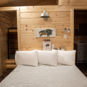 Buffalo Cabin bedroom. decorated with Buffalo imagery